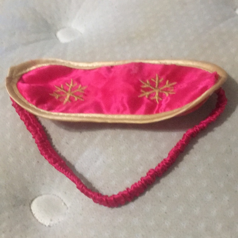 A pink silk  bath and body works sleep mask